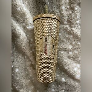 Venti gold Starbucks cup